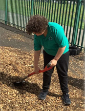 Pupils helping distribute woodchips